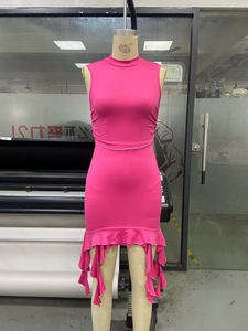 Detail of rose red sleeveless high neck dress with side ruching and ruffled hemline