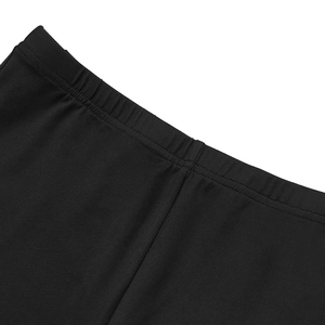 Close-up of elastic waistband on black knitted shorts with durable double-needle stitching