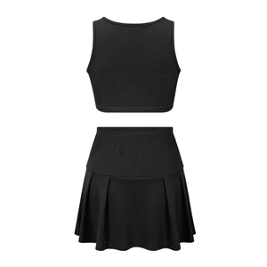 Detail view of the back of a black two-piece sporty set with crop tank top and pleated skirt
