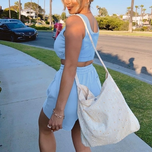Women's light blue two-piece crop top and drawstring shorts set for summer sports