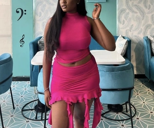 Detailed view of women's sleeveless top and ruffled mini skirt set in vibrant rose pink