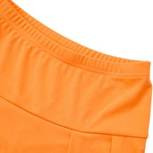 Detail of high-waist elastic waistband on bright orange slim fit sports tennis skirt