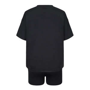 Rear view of women's black two-piece casual set with loose T-shirt and cycling shorts