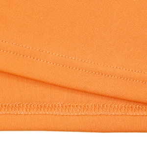 Close-up of orange knitted fabric showing double-needle stitching and breathable texture