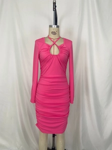 Detailed view of neon pink bodycon dress with hollow out front and ruched texture