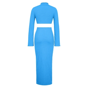 Detail of blue ribbed knit texture on long sleeve cropped top and maxi skirt set