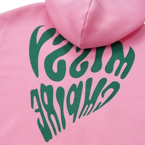 Close-up of pink hoodie fabric featuring a high-quality green Missy Empire graphic print