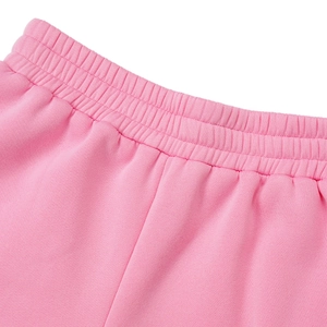 Detail of pink sports pants featuring reinforced wide elastic waistband with parallel stitching