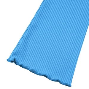 Close-up of ribbed sky blue knit fabric featuring elegant lettuce edge hem detail