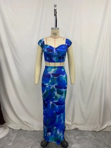 Detailed view of tie-dye crop top with gathered chest and high waist skirt set