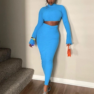 Women's two-piece knitted set featuring long sleeve crop top and maxi skirt in turquoise