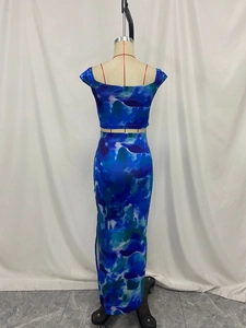 Detailed close-up of a blue and green tie-dye two-piece crop top and long skirt set