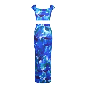 Macro detail of watercolor marble print fabric on crop top and maxi skirt set