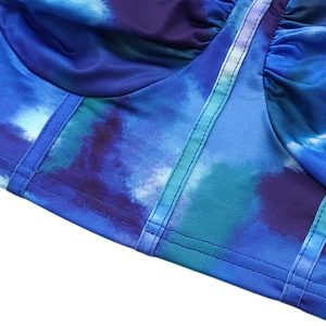 Detail of crop top featuring blue and purple abstract watercolor print and vertical seams