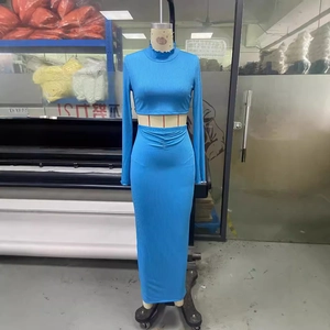 Bright blue ribbed knit two-piece set featuring a high neck crop top and high waist maxi skirt