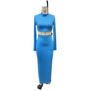 Sky blue two-piece set featuring long sleeve crop top and bodycon maxi skirt with rib texture