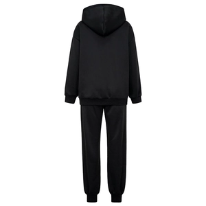 Detail view of the black knitted hoodie and joggers set showing ribbed cuffs and hem