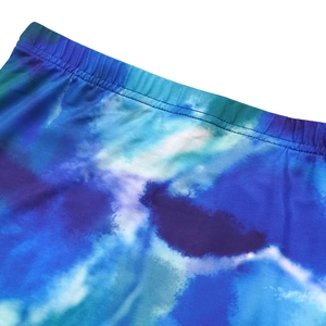 Detail view of the flatlock stitching and elastic waistband on tie-dye printed dress