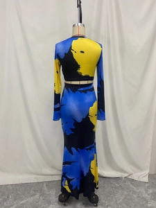 Detailed view of women's long sleeve crop top and maxi skirt set with abstract blue print