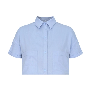 Close-up of light blue cotton linen shirt featuring large front pockets and lapel collar