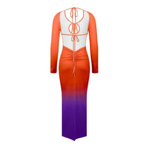 Detail of the backless ombre dress with crisscross straps and ruched fabric texture