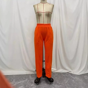 Women's high waist straight leg trousers in bright orange with elastic pleated waistband