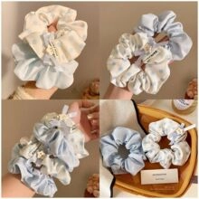 Floral print scrunchies in light blue and white colors displayed in a four-grid layout