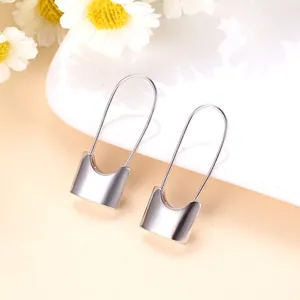 Minimalist safety pin lock drop earrings with a sleek silver-tone finish for women.
