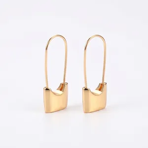 Minimalist 18k gold plated copper safety pin lock earrings with a sleek retro style