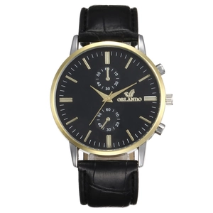 Detailed macro view of the Orlando business watch featuring golden bezel and leather strap