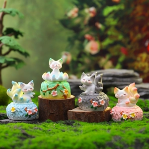 Set of four cute resin fox figurines on mossy wood for healing desk decor ornaments