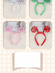 Macro detail of plush spiral horn headbands in white green pink and red colors
