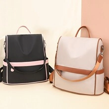 Front view of two minimalist backpacks in black and beige with durable nylon texture