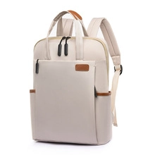 Detail view of water-resistant nylon backpack with laptop compartment and brown leather trim