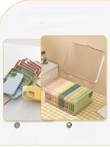 Close-up of clear acrylic storage box with dustproof lid for organizing phone cases