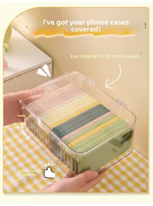 Detailed view of clear acrylic organizer box with flip lid holding 20 phone cases