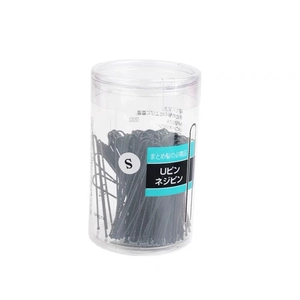 Detailed view of black U-shaped hairpins in a clear cylindrical box for hairstyling