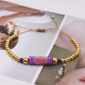 Handmade Bohemian Miyuki bead bracelet with golden accents and adjustable cord