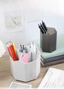 Close-up of hexagonal multi-grid rotating organizer for stationery on a wooden desk