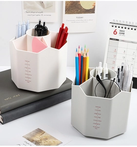 Close-up of a rotating desktop organizer with a hexagonal honeycomb design and 6 slots