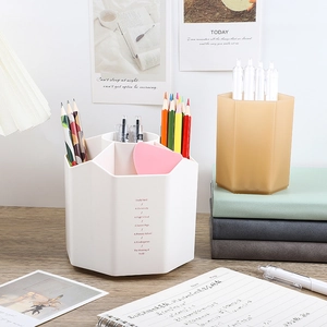 Rotating hexagonal desk organizer with multiple compartments in white and brown