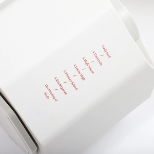 White polygonal desk organizer with red motivational text for office and stationery