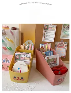 Close-up of Japanese style desktop pen holder with tilted dividers for office supplies