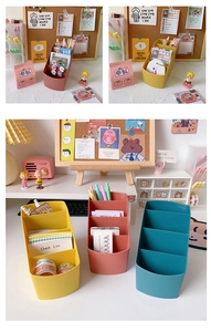 Close-up of four-tier pastel desk organizer for stationery, pens and makeup brushes