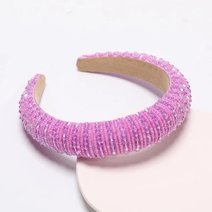Detail of purple and pink beaded wide headband with crystal sequins on soft fabric