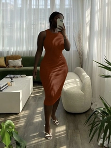 Rust red knit sleeveless midi dress with vertical ribbed texture and crew neckline