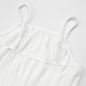 Detailed macro view of white ribbed fabric texture and stitching on seamless camisole strap