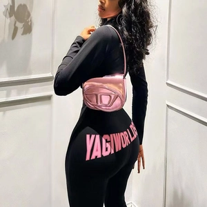 Women's tight long sleeve black two-piece set with pink lettering and metallic bag