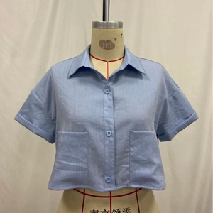 Women's light blue short sleeve cropped shirt with lapel collar and double pockets