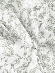 Detail of floral printed dress featuring elastic waist and high-quality invisible zipper